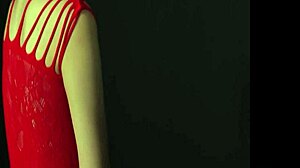 A stunning woman with charming breasts entices you in a provocative pose while wearing a seductive red dress